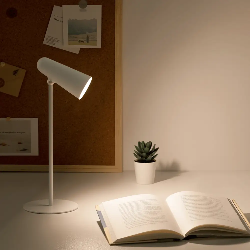 Xiaomi MJTD05YL LED Lamp for Reading and Study Xiaomi MJTD05YL LED lamp illuminating a book on a study desk