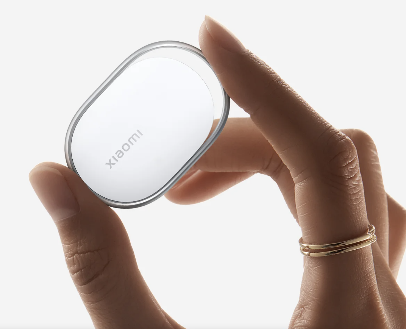 Xiaomi Tag Bluetooth Smart Tracker Xiaomi Tag Bluetooth smart tracker on a plain background