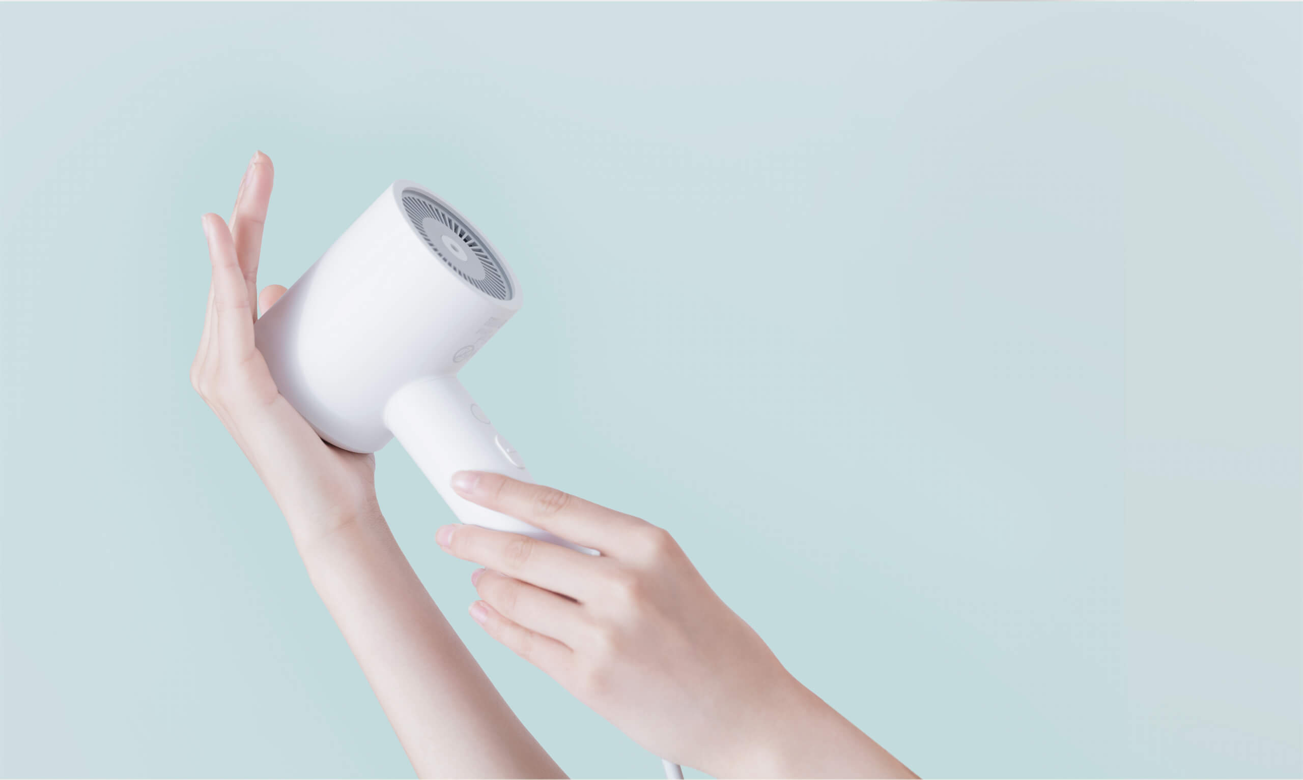 Xiaomi Mijia H300 Hair Dryer Lifestyle Image Woman holding a white Xiaomi Mijia H300 hair dryer beside her long hair against a dark background