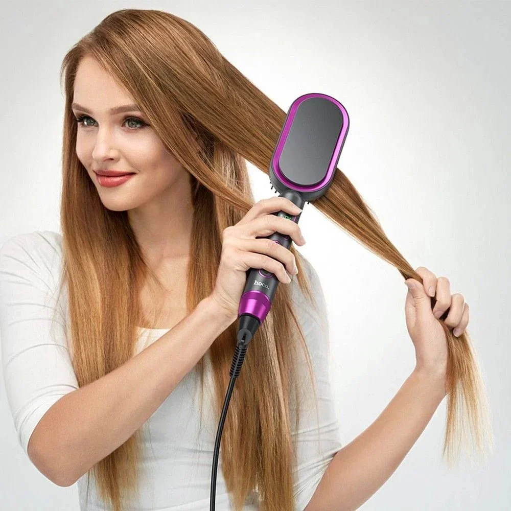 Hoco Hair Straightening Brush in Use Woman styling her long hair with a black and purple Hoco hair straightening brush
