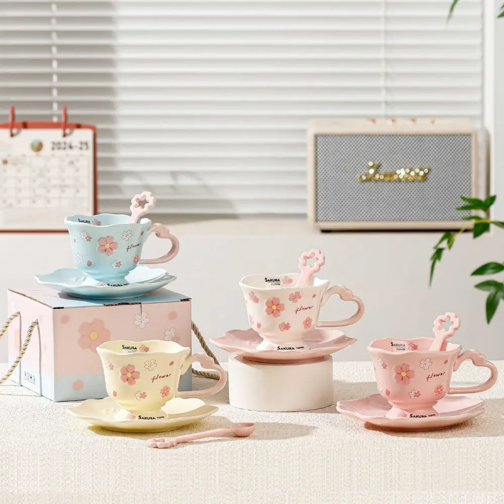 Colorful ceramic cups with saucers