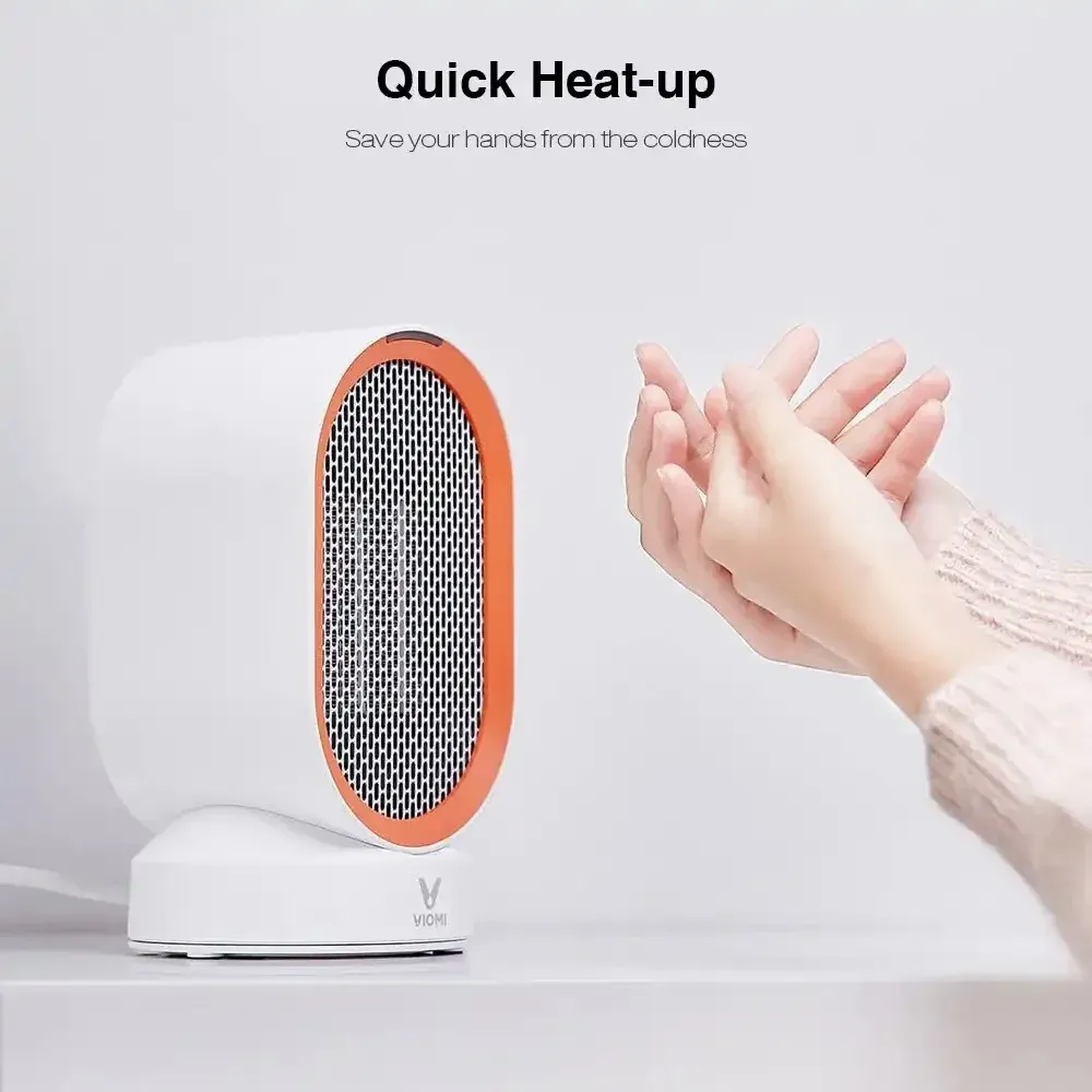 VIOMI VXNF01 Heater – Hand-Warming Feature VIOMI VXNF01 desktop heater with orange trim shown warming a person's hands