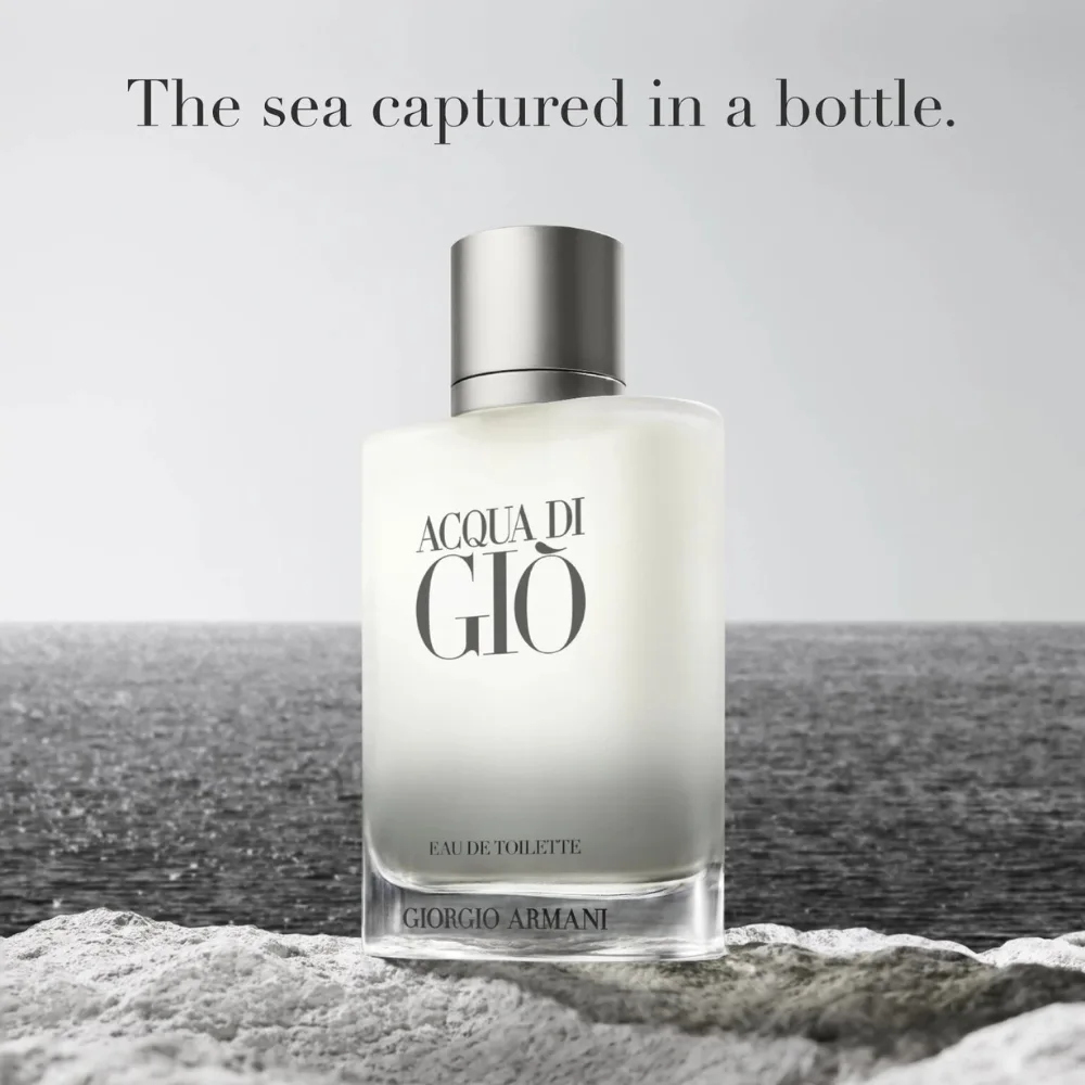 Giorgio Armani Acqua di Gio EDT Seaside Bottle Giorgio Armani Acqua di Gio EDT frosted glass bottle on rocks beside the sea